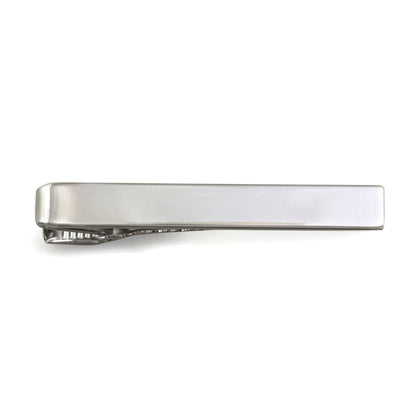 A plain polished tie bar displayed on a neutral white background.