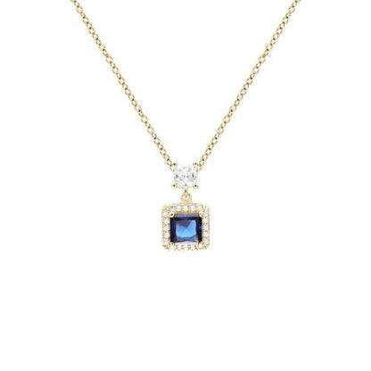 A blue gemstone simulated diamond square necklace displayed on a neutral white background.